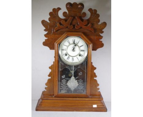 Antique Waterbury mantle clock with striking movement, key and pendulum included, 56cm high