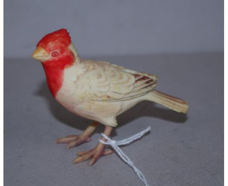 Antique Japanese ivory red tinge bird figurine C1920, signed to base,6cm high approx. May not be exported without CITES docum