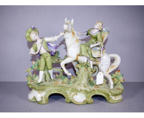 Vintage German bisque ceramic figure standing man with woman on horseback, no marks evident. Height 23cm Length 28cm approx.