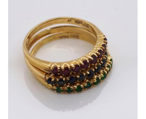 A set of three multi gem 14ct gold child's rings Sapphire, ruby and emerald examples marked 14k 585 approx 3g, size H