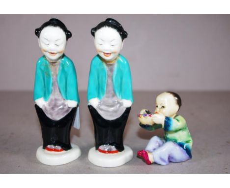 Pair Royal Worcester Chinese standing man figures marked to base and # 3554, (both with head restored); together with Royal W