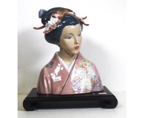 Lladro Japanese woman figure woman with elaborate head dress, wearing a kimono, on wood stand. Marked to base and # 1488. Hei