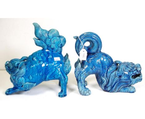 Near pair Chinese ceramic temple  dogs Blue ceramic figures, (1 with restored leg and chip to ear). Height 23cm approx (talle