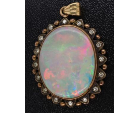 Antique gold and opal pendant with diamond dots star burst frame. Unmarked opal 21mm x 17.5mm
