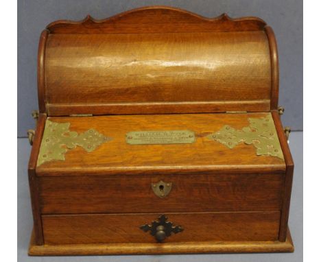 Early 20th century oak desk organizer with mechanical lid opening to a inkwell, letter files above a lower drawer, presentati
