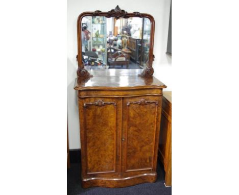 Victorian walnut mirror back side cabinet with serpentine front and scrolled carving, the 2 doors opening to an inside shelf,