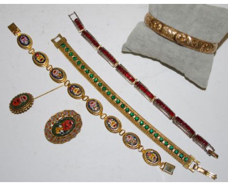 Four various vintage costume bracelets together with a mosaic brooch and stick pin