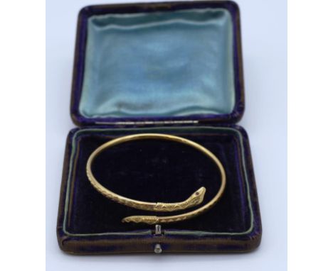 Hellenistic style gold snake bangle with ruby eyes Marked 9ct Birmingham 1987 approx 5.28g