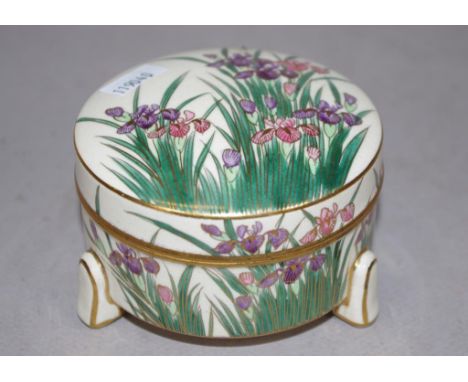 Japanese Satsuma ceramic lidded bowl iris decoration to lid and sides, tri-footed, marked to base. Diameter 9.5cm approx.