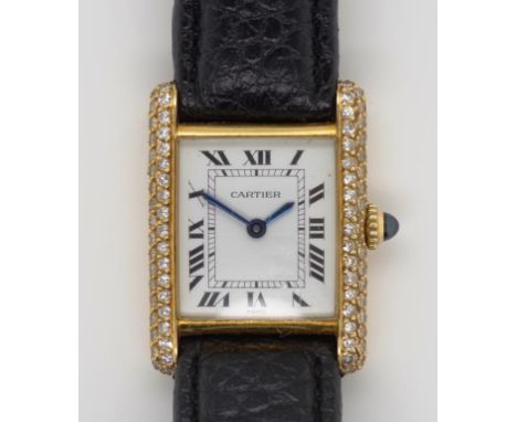 Cartier ladies gold & diamond tank watch with manual wind movement, diamond encrusted sides of the 18ct yellow gold case. Wor
