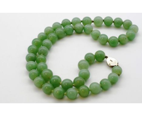 Vintage green jade bead necklace marked silver clasp approx 49 x 12mm jade beads. 57cm Long