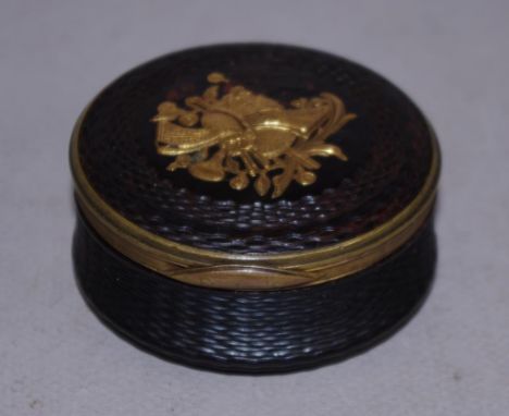 Georgian carved tortoiseshell trinket box Circa 1800, with gilt top decoration and brass fittings, diameter 7cm approx