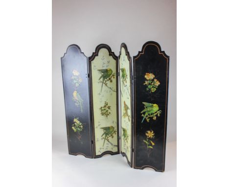 A black lacquered four-panel fire screen with arched top , painted decoration of birds on flaming branches, 64.cm wide