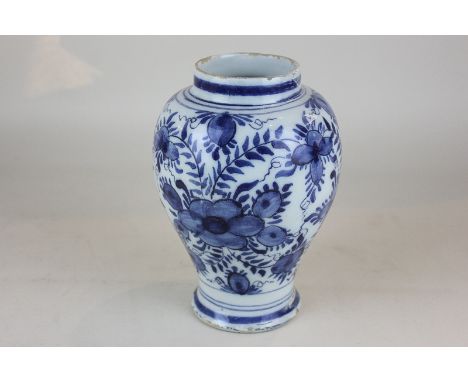 A Delftware pottery vase, ovoid form with floral decoration (a/f - restored), 19cm high