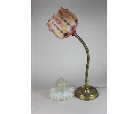 An early 20th century desk lamp with unusual glass shade, and another glass shade, 54cm high