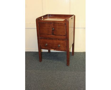 A George III mahogany cabinet commode enclosed by two doors, 54cm