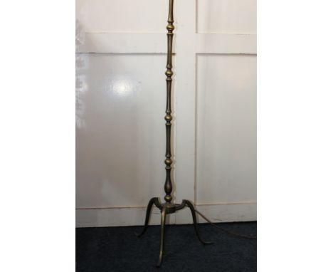 A 19th century oval gilt wall mirror, together with a brass standard lamp on tripod base