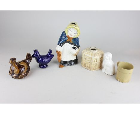 A Zsolnay earthenware tea caddy embossed with religious figures, together with various items of pottery including a chicken m