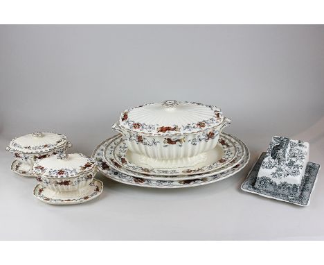 A Victorian earthenware part dinner service comprising three graduated serving dishes, a large tureen and cover and two small