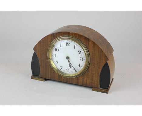 An early 20th century French walnut mantel clock with brass bevel over circular white enamel dial with Arabic numerals, 13.5c