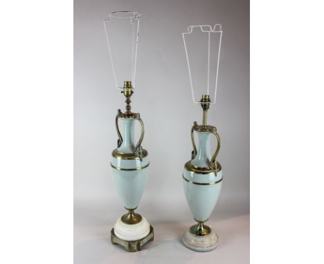 Two near matching Victorian enamel and brass urn table lamps with mask head handles on white onyx bases, 57cm