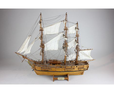A wooden model of HMS Bounty (1787) with full rigging and sails, 62cm