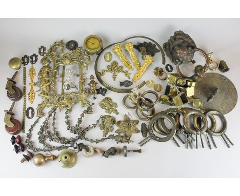 Various brass, ormolu and gilt furniture fittings including floral swag, paw feet, ram's heads, castors, etc, together with a