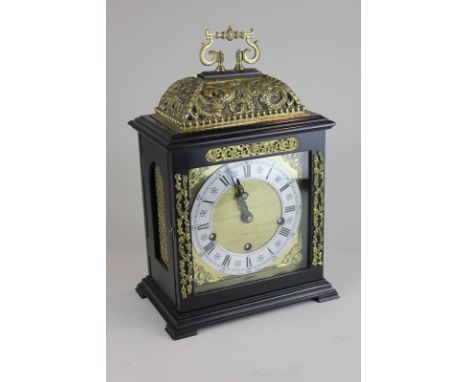 A 20th century ebonised bracket clock with ormolu decoration, the square gilt face with white enamel dial marked Rapport Lond