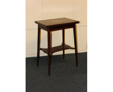 An Edwardian inlaid mahogany games table with tapered legs and shelf stretcher, 51cm