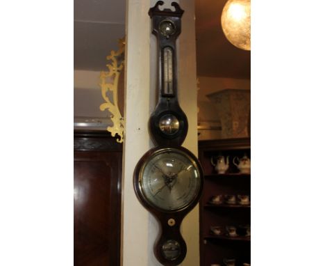 A 19th century wheel barometer, maker lee, Belfast, with thermometer, spirit level and humidity dial 96cm