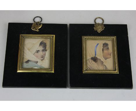 A pair of portrait miniatures in ebonised frames of a young woman in a bonnet and a woman in a cloth cap, 5cm by 6cm