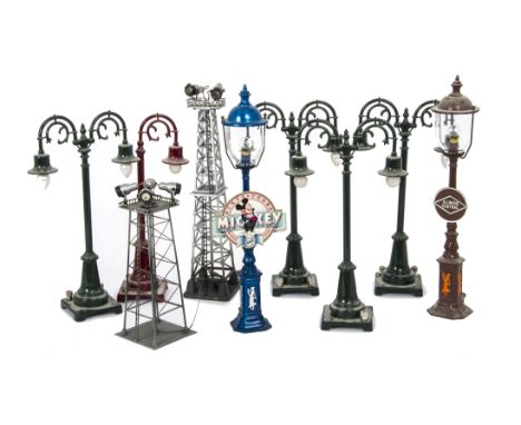 A Collection of American 0 Gauge Streetlights by MTH and Others, mostly repro Lionel products including 2 orange no 57 ‘Broad