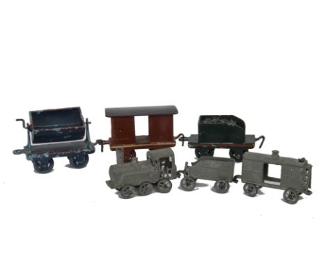 A Small Floor Train by Simon et Rivolet and another, the S & R train a small 0-6-0 with tender and van, made in lead and pain
