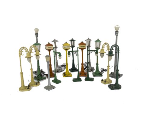 A Collection of American 0 Gauge Streetlights by Lionel, including 2 orange no 57 ‘Broadway’ lights and one yellow, two silve