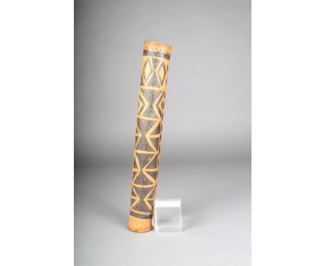 An Oceanic bamboo flute/pipe, with incised and scorched decoration, pierced at one end and through the main body, 37cm long.