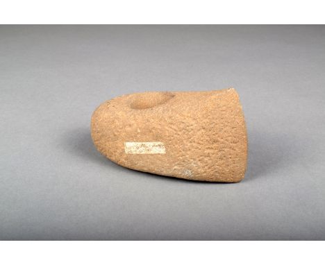 A stone axe head by Flint Jack, with paper label inscribed 'Made by Flint Jack Decr 17. 1868.' 13cm long. Flint Jack, the so 