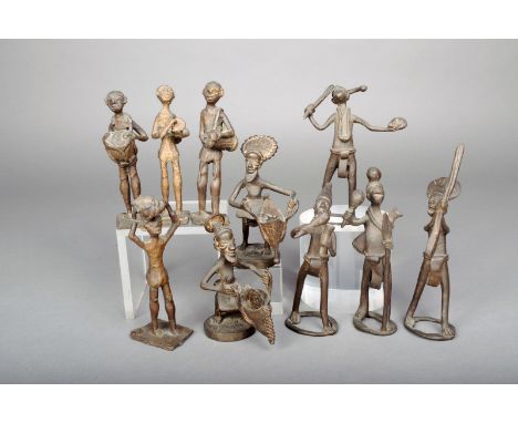 Ten brass figures, Ivory Coast, including a pair with baskets and three playing drums, 18.6cm the highest. (10) Provenance Dr