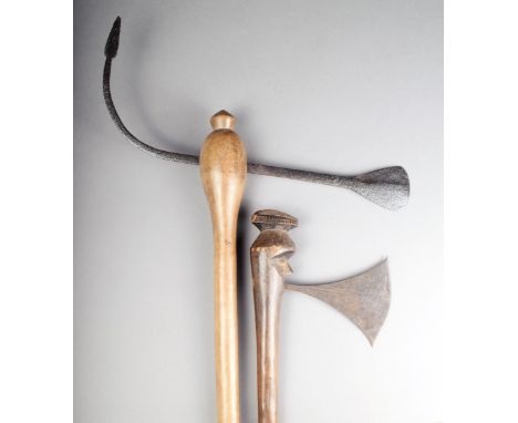 A Congo axe, with a flared iron blade, the wooden shaft with a carved head terminal with cresting, 42.6cm long and a wooden s