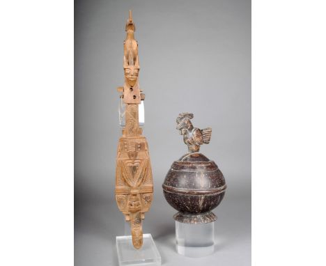 A Batak lute, Indonesia, carved wood, no strings, 59.5cm high, and a Sumba carved coconut bowl and cover with a bird finial, 