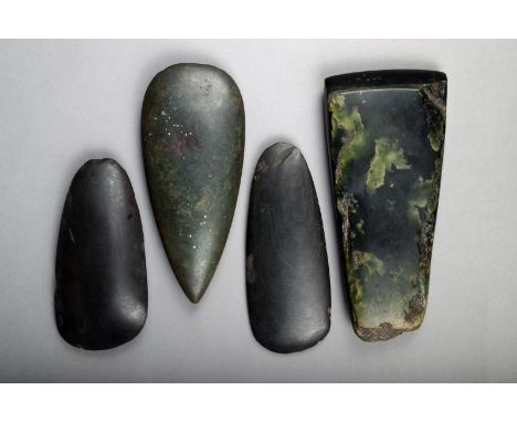 A Maori greenstone adze blade, 19th century, 20.5cm long and three stone adze blades. (4)
