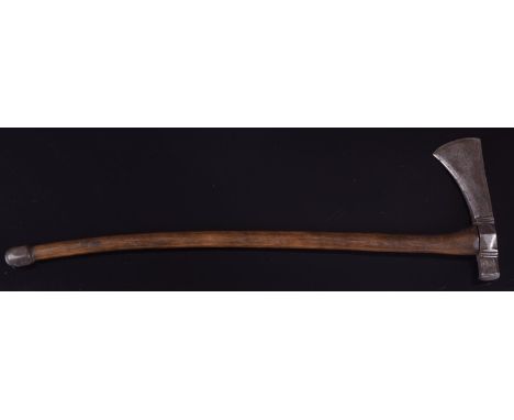 λ A South African rhinoceros horn handled axe, mounted with a British made steel blade, the tapering curved shaft, with a rin