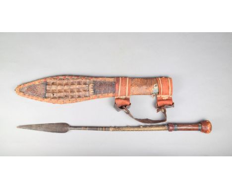 A Touareg hand spear, with a leaf blade and copper and brass bands, pierced brass mount and leather handle, 79cm long with a 