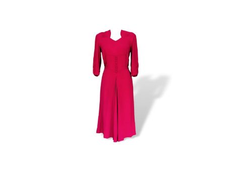 CC41 1940s dress, in a raspberry crepe, typical 40s design with sweetheart neck line. Size 10, the camera picked up a glare n