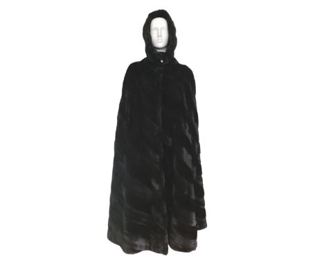 A 1960s couture full length mink cape and matching snood/hat that fastens under the chin with a single decorative diamanté bu