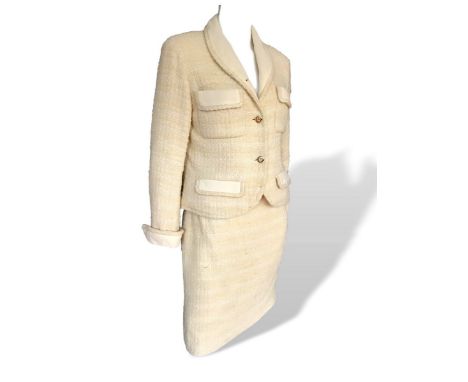 Chanel Boutique 2 piece suit, 1980s. Has chain trim inside and silk lining. Skirt has been altered at some point to make bigg