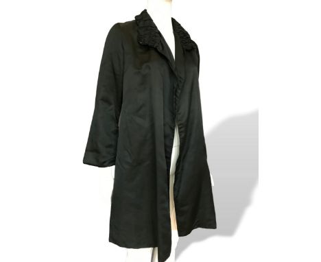 A black satin 1940s/1950s era evening coat with quilted collar feature, 40 bust and 36 length. Together with a green 1960s ma