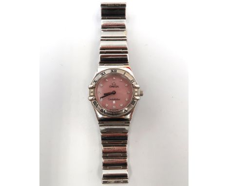 An Omega Constellation ladies watch, pink champagne coloured dial, roman numerals to bezel, case diameter 20mm approx, workin