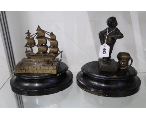 A group of bronze and brass wares comprising a cast bronze Qualcast advertising figure of a paper boy, titled 'Speshul', with