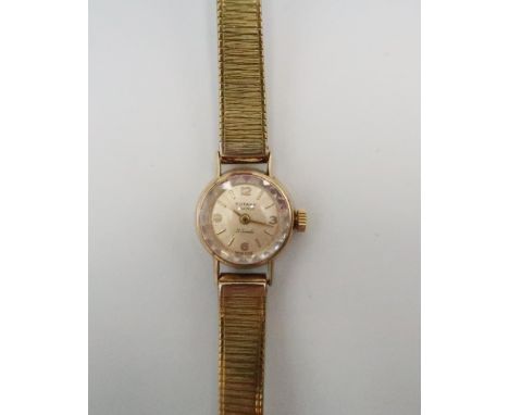 A 9ct gold cased, vintage cocktail watch, with gold plated bracelet strap, marks likely inside, testing as 9ct, total weight 