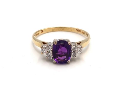 An 18ct yellow gold amethyst and diamond ring, diamonds are well matched and bright and lively, head size approx 14mm x 8mm, 